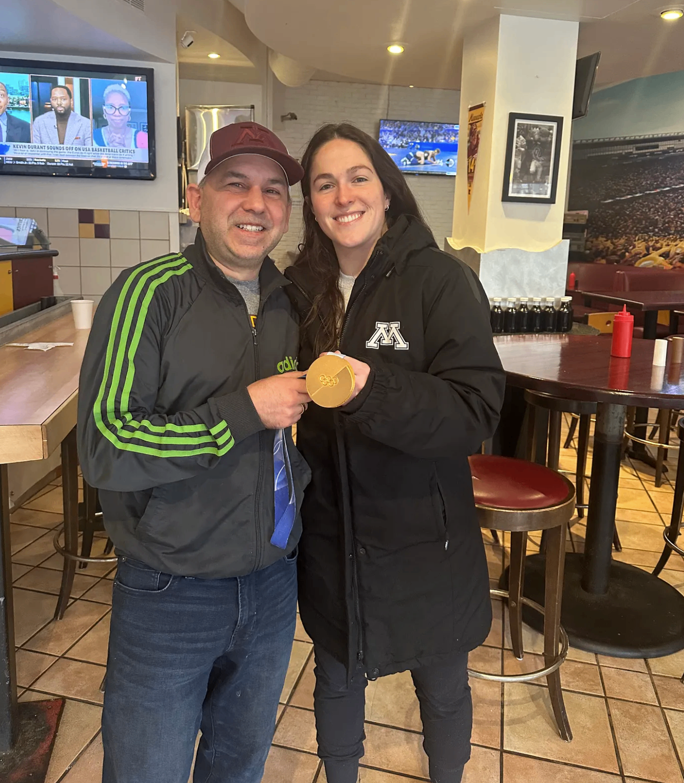 Tony and Murphy with the 2026 Women's Hockey Gold Medal